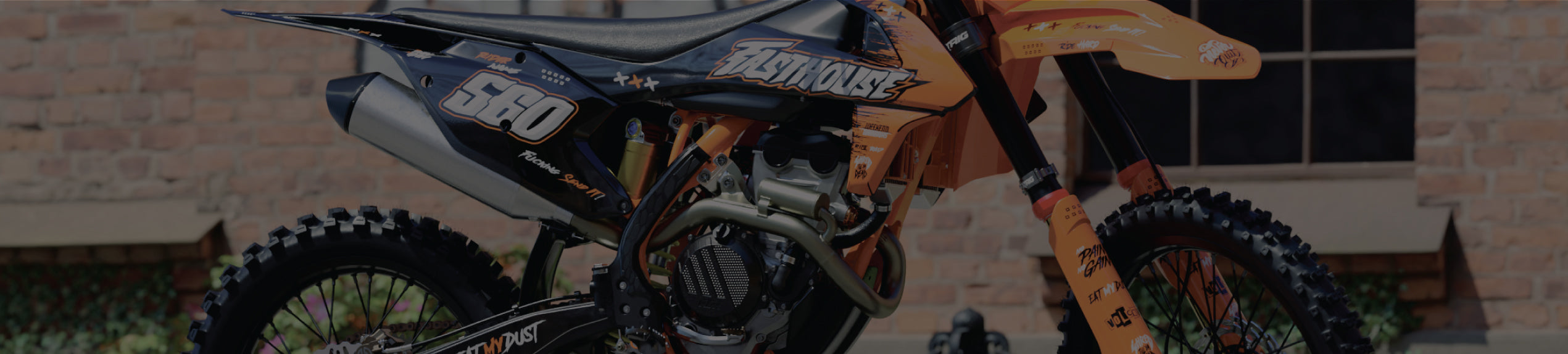 Graphics kit for KTM dirt bike on orange and black plastics