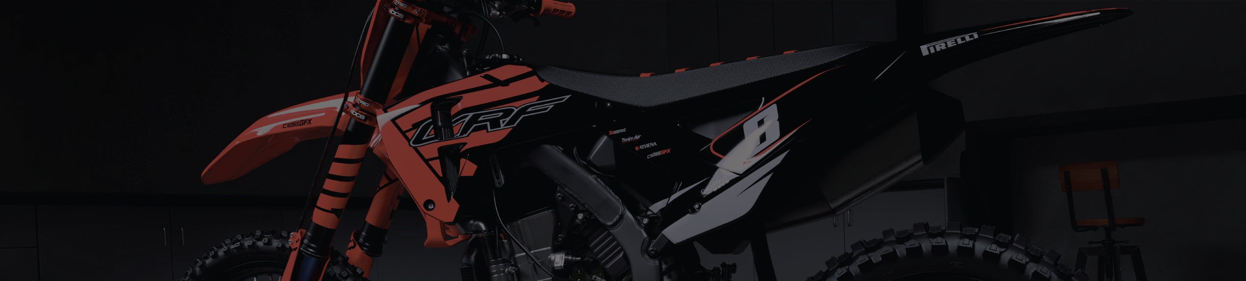 Crisp red decal kit for Honda MX dirt bike in garage background