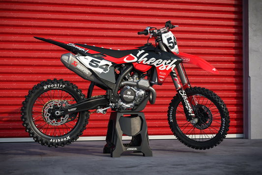 Promotional view of the Sheesh Black custom decal kit on a GasGas motorcycle.
