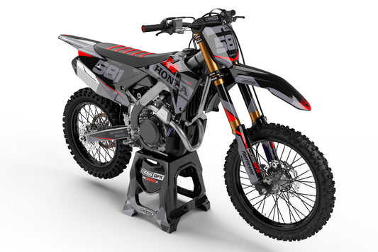 Front view of the Blitz Black graphics kit on a Honda motocross bike.