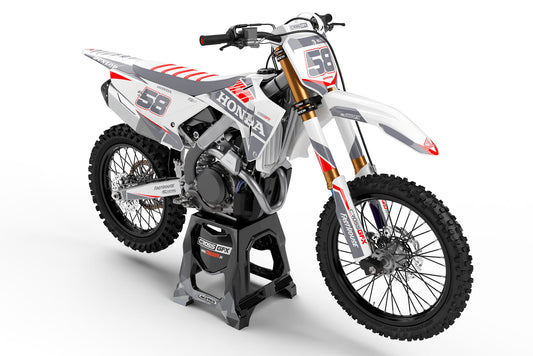 Front view of the Blitz White graphics kit on a Honda motocross bike.