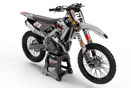 Front view of the Crisp Grey graphics kit on a Honda motocross bike.