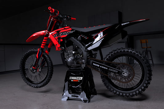 Promotional view of the Crisp Red graphics kit on a Honda dirt bike.