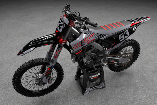 Promotional view of the Force Black graphics kit on a Honda dirt bike.