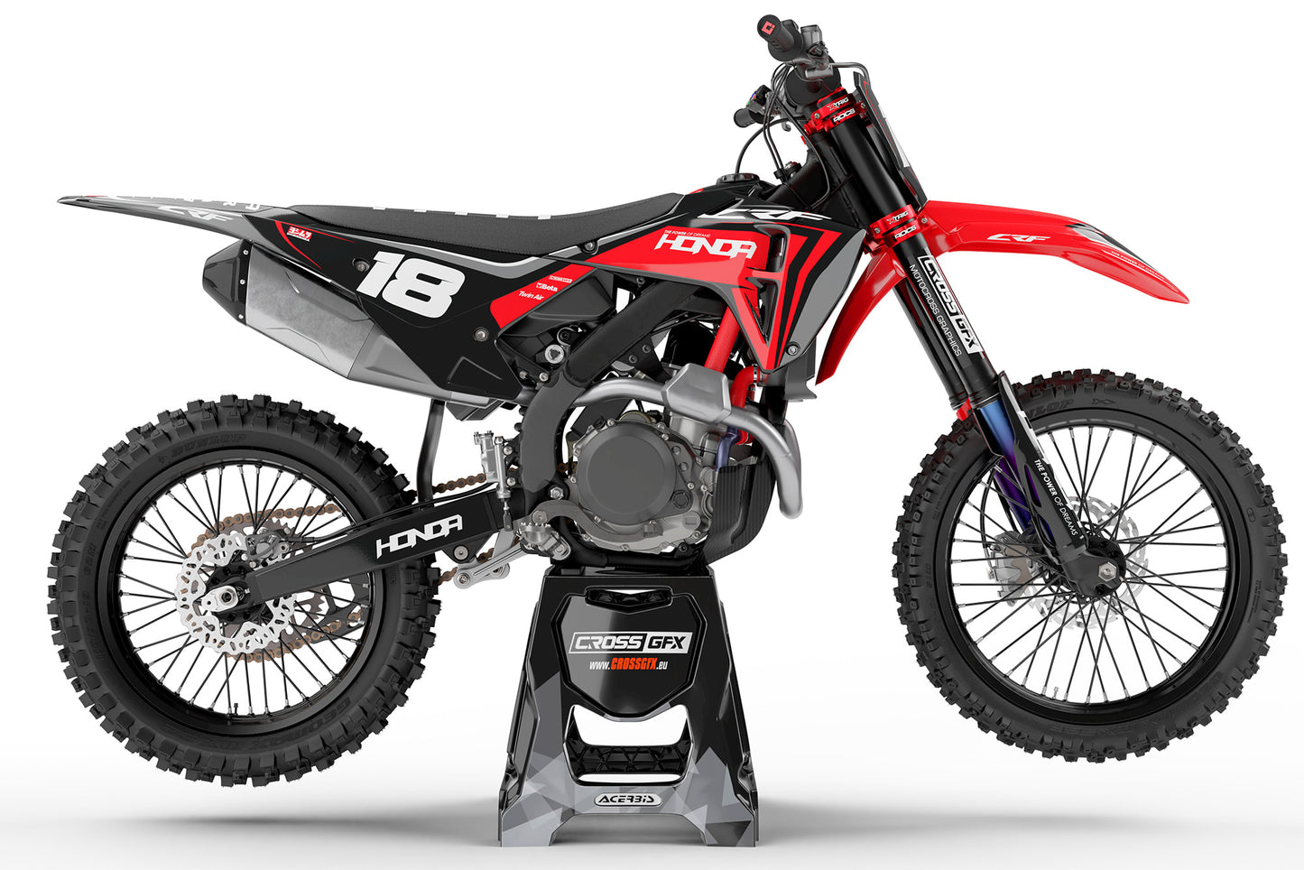 Side view of the Nitro Black motocross graphics kit on a Honda racing bike.