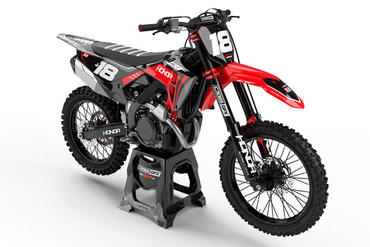 Front view of the Nitro Black graphics kit on a Honda off-road motorcycle.