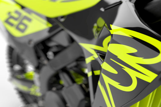 Promotional view of the Retro 94 Fluorescent decal kit on a Honda dirt bike.