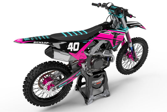 Rear view of the Surge Pink graphics kit on a Honda dirt bike.