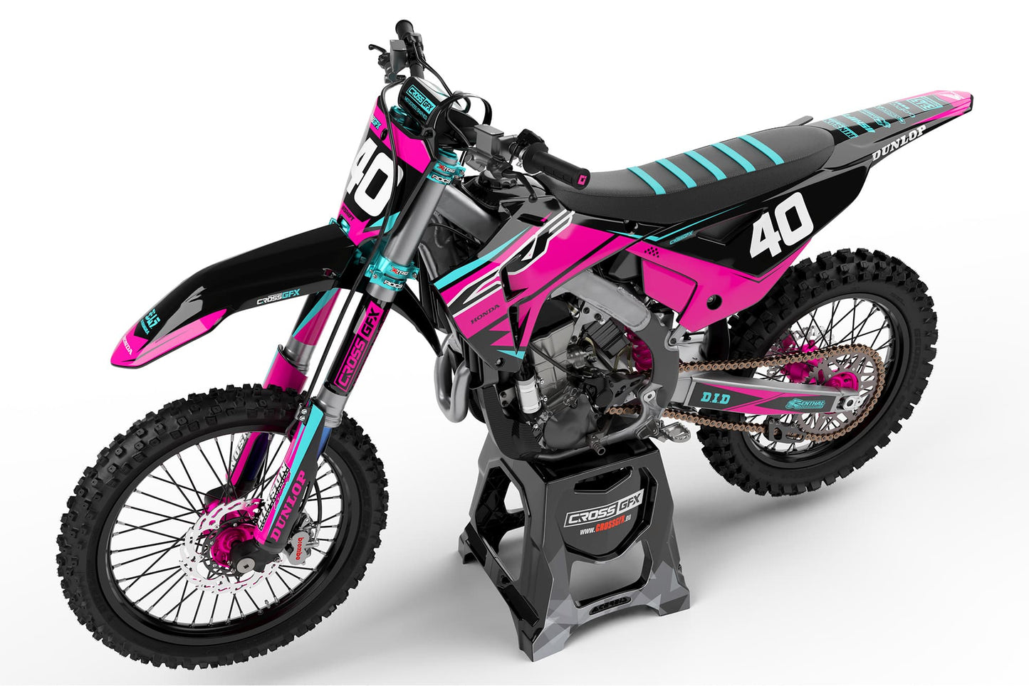Left side view of the Surge Pink graphics kit on a Honda dirt bike.