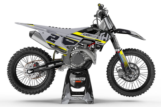 Side view of the Xcel Black off-road decal kit on a Husqvarna dirt bike.