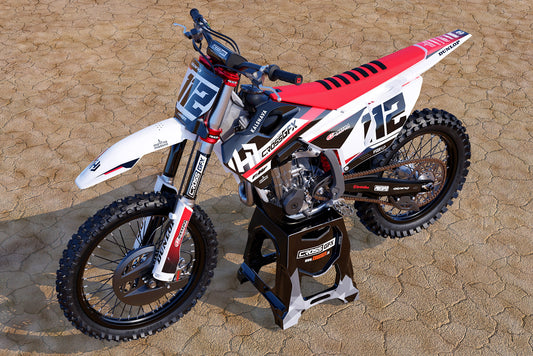 Promotional view of the Xcel Red decal kit on a Husqvarna off-road motorcycle.