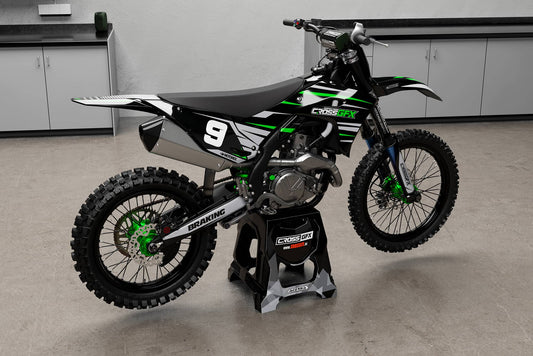 Promotional image of the APEX Black graphics kit for a Kawasaki motocross bike.