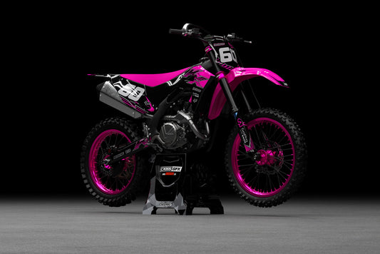 Promotional image of the PEAK Pink graphics kit for a Kawasaki motocross bike.