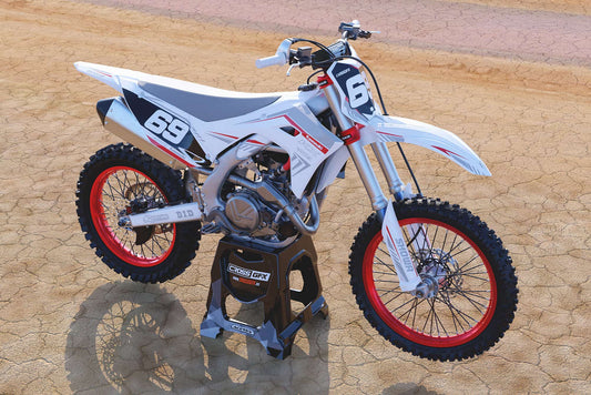 Promotional image of the SHIFT White graphics kit for a Kawasaki motocross bike.