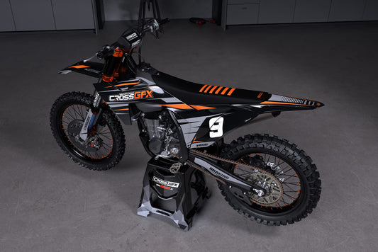 Promotional view of the Apex Black custom decal kit on a KTM motorcycle.