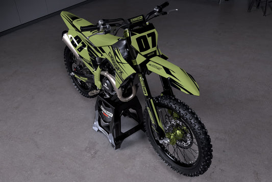 Promotional view of the Apex Military enduro graphics kit on a KTM motorcycle.