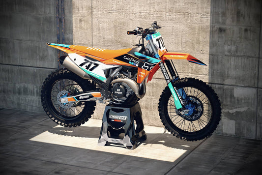 Promotional view of the Cord Orange custom decal kit on a KTM motorcycle.