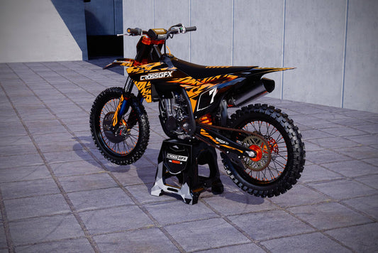 Promotional view of the Element Orange custom decal kit on a KTM dirt bike.