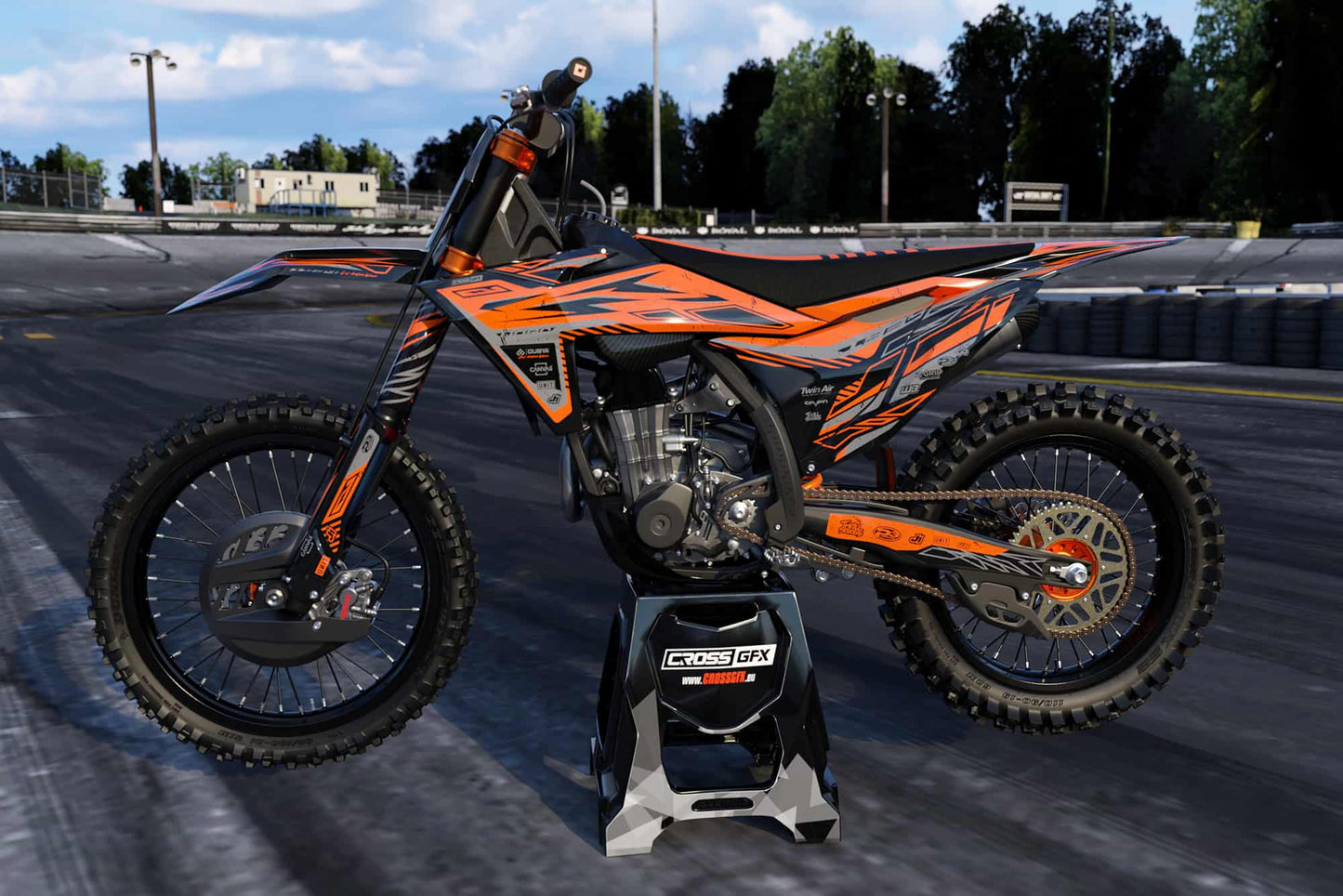 Promotional view of the Omega Orange custom decal kit on a KTM dirt bike.