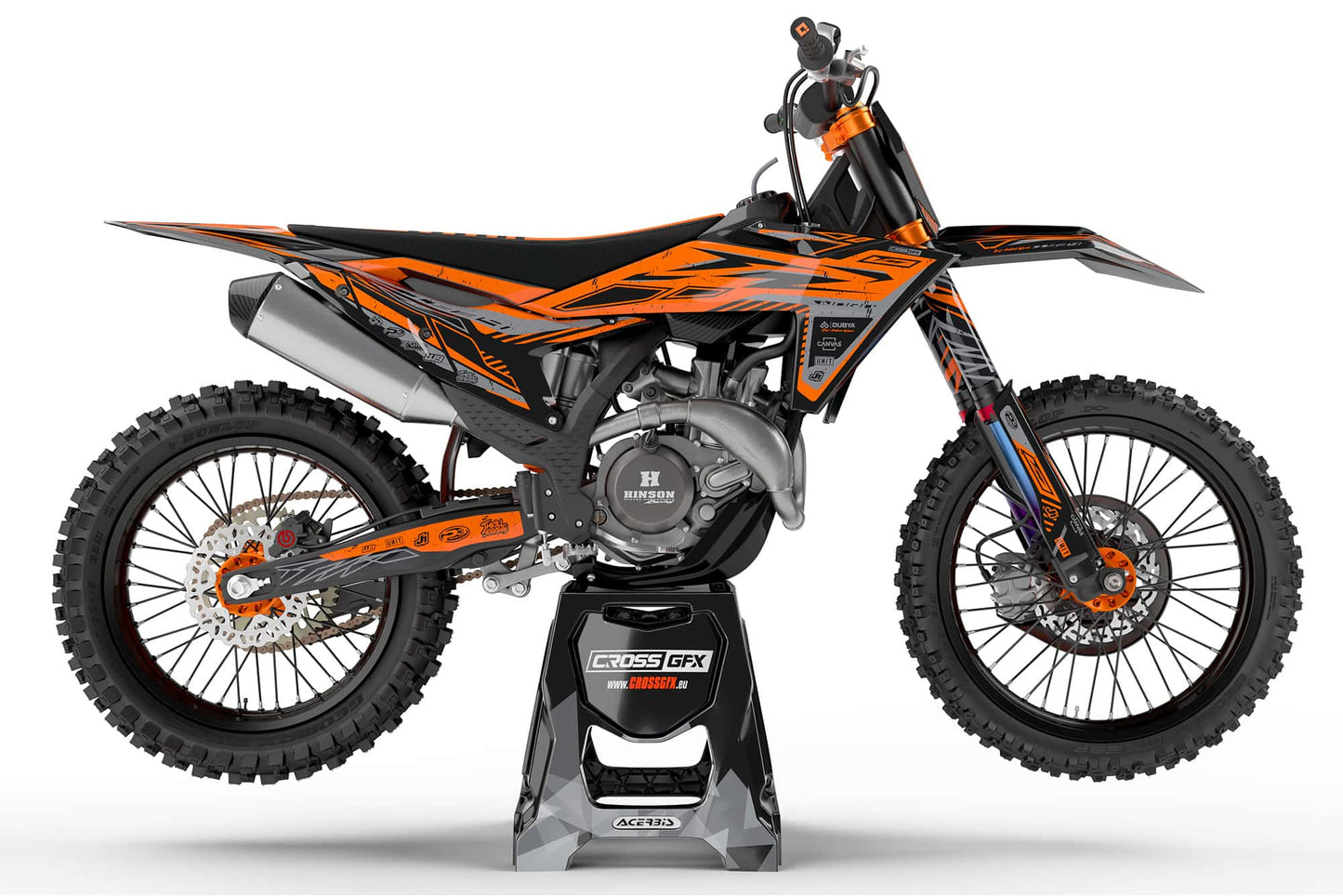 Side view of the Omega Orange racing graphics kit on a KTM dirt bike.