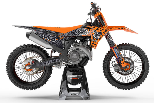 Side view of the Orange Panther off-road sticker kit on a KTM dirt bike.