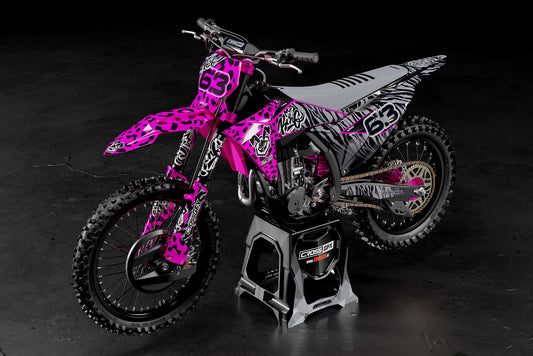 Promotional view of the Pink Panther enduro decal kit on a KTM dirt bike.