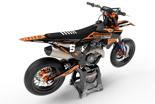 Rear view of the Volt Orange custom decal kit on a KTM dirt bike.
