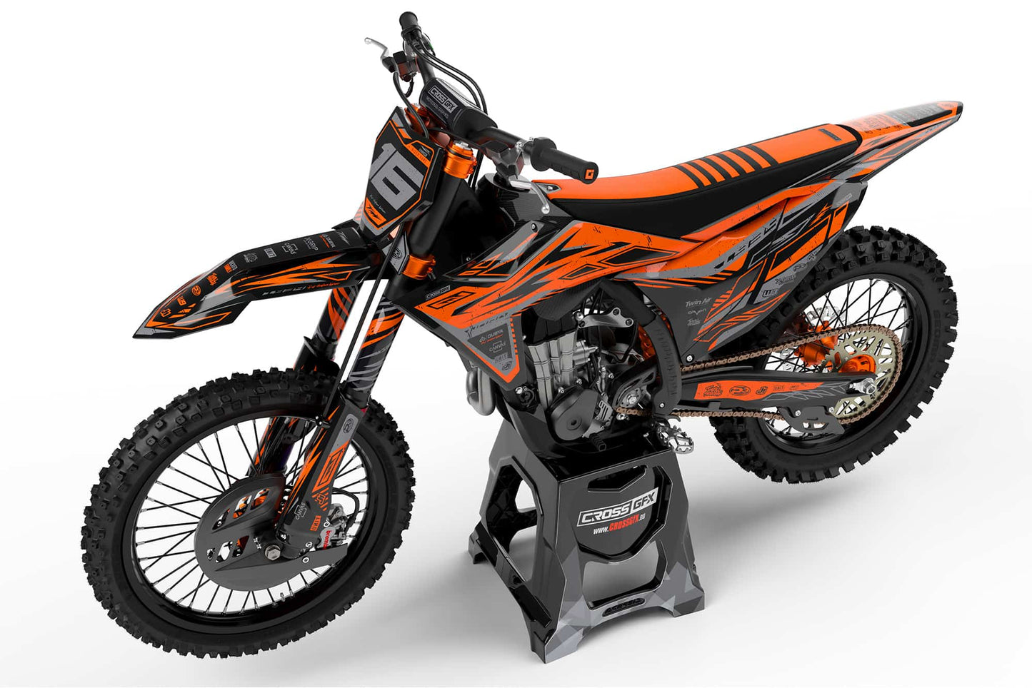 Left side view of the Omega Orange off-road decal kit on a KTM.