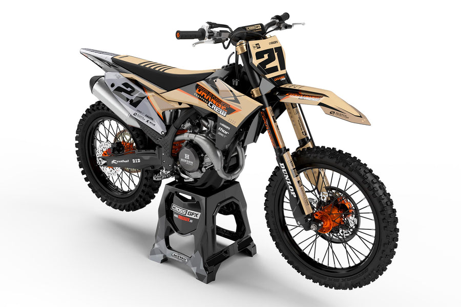 Front view of the Orange Crew motocross graphics kit on a KTM dirt bike.