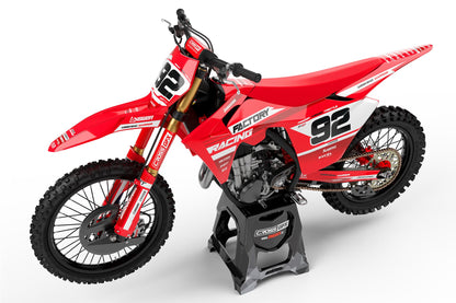 Left side profile of the Factory Red racing stickers on a GasGas dirt bike.