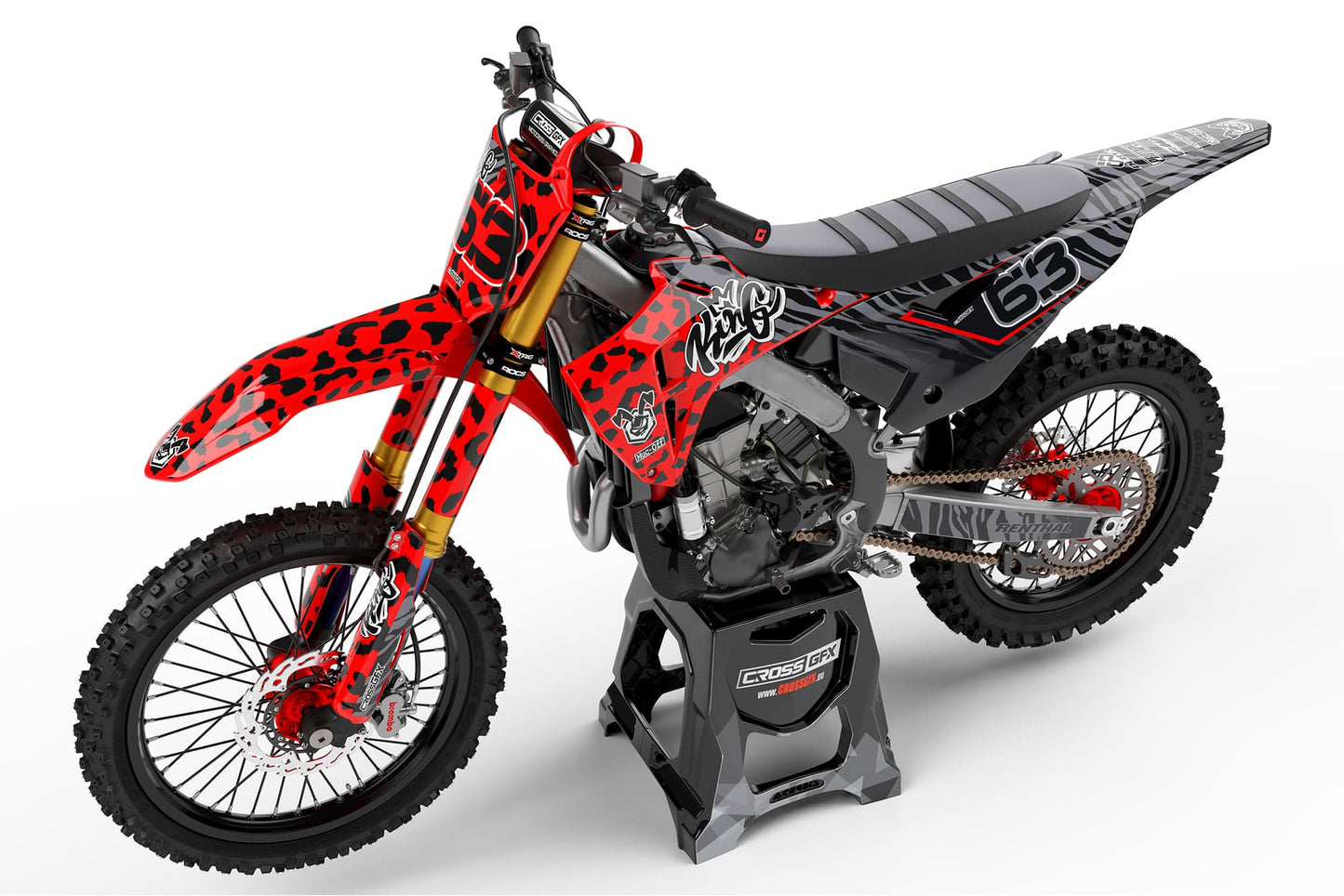 Left side view of the Red Panther racing graphics kit on a Honda dirt bike.