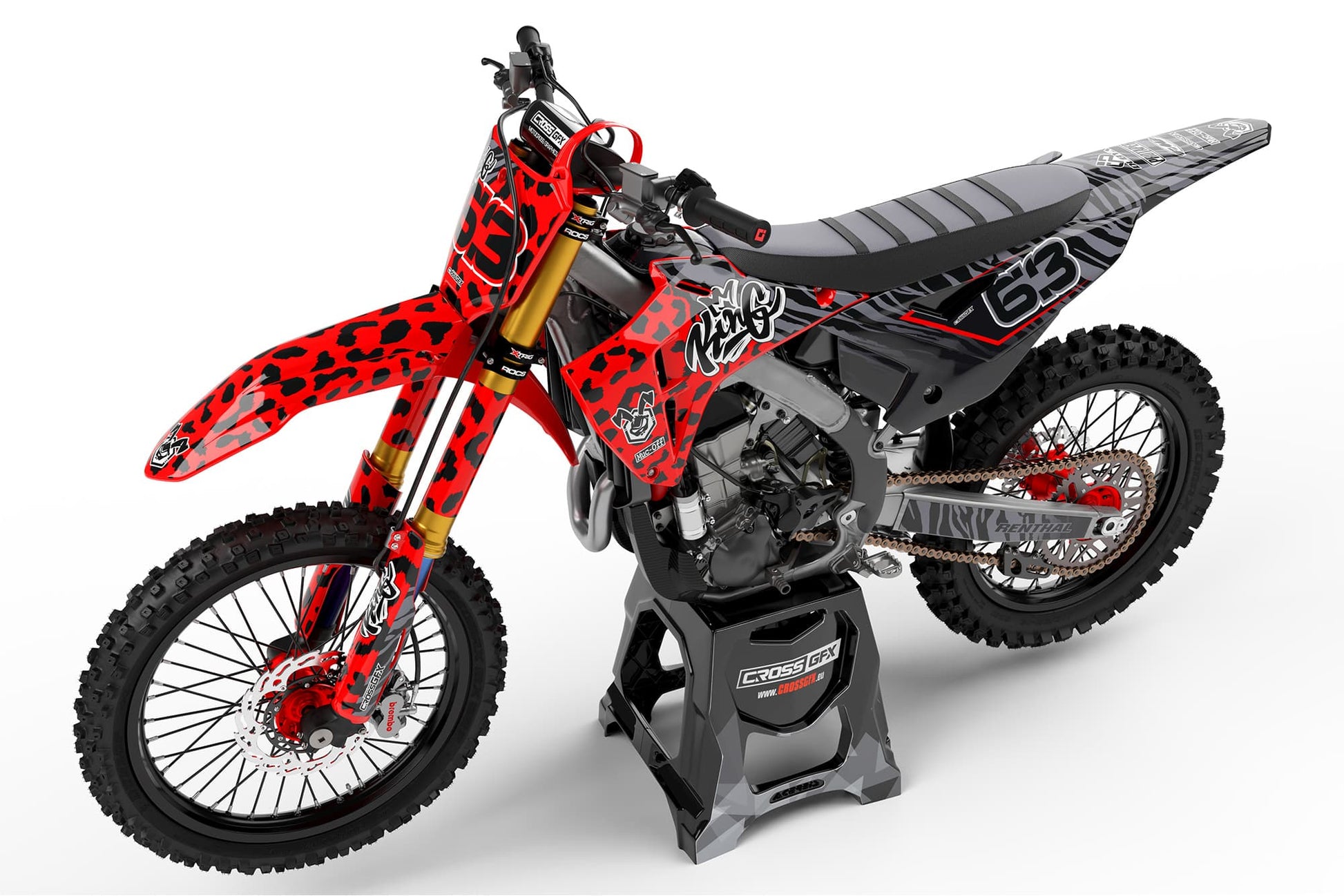 Left side view of the Red Panther racing graphics kit on a Honda dirt bike.