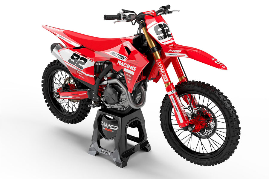 Front view of the Factory Red motocross graphics kit on a GasGas dirt bike.