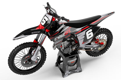 Side view of the Apex Black racing graphics kit on a GasGas dirt bike.