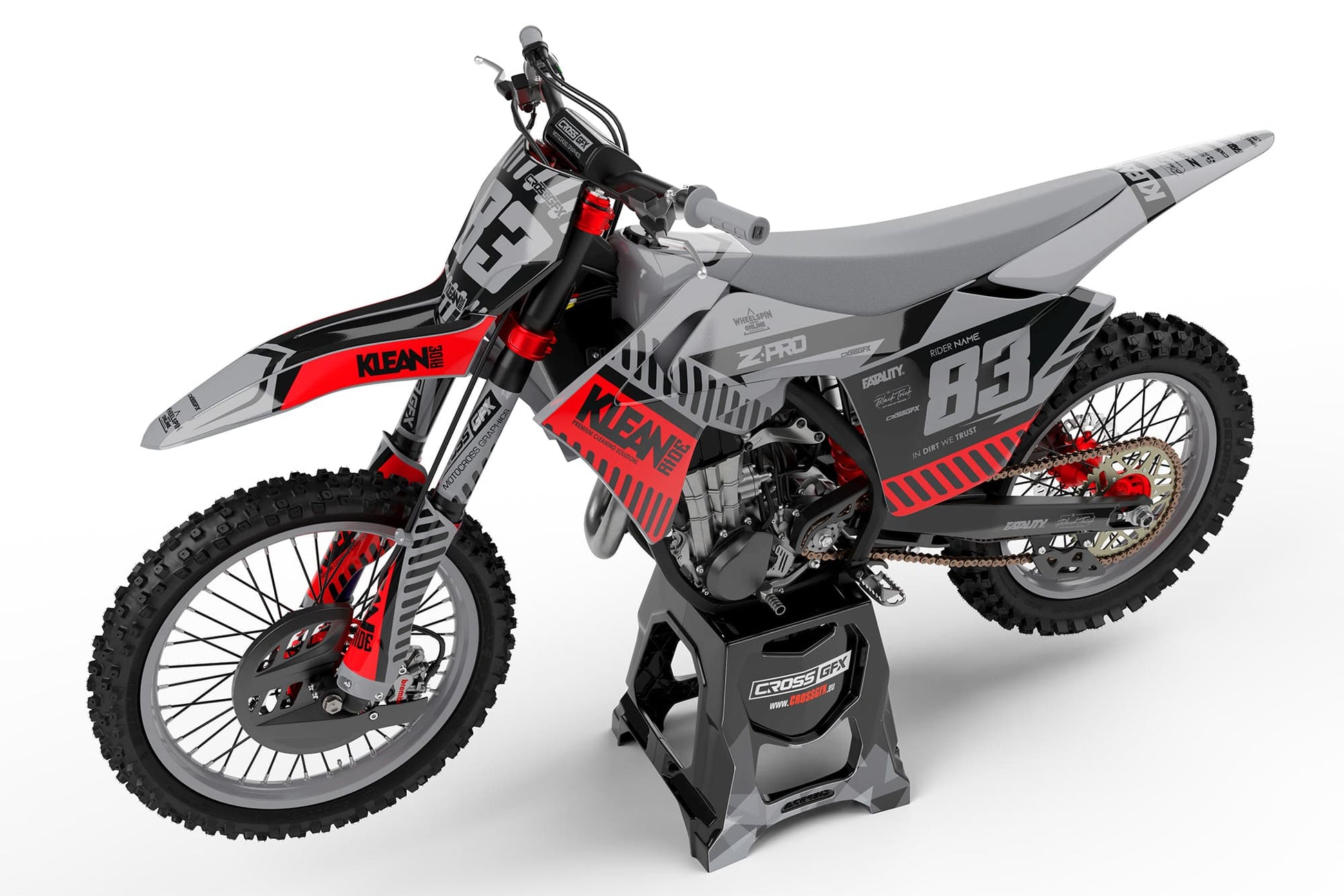 Side view of the Clean Grey racing graphics kit on a GasGas dirt bike.
