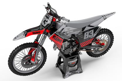Side view of the Clean Grey racing graphics kit on a GasGas dirt bike.