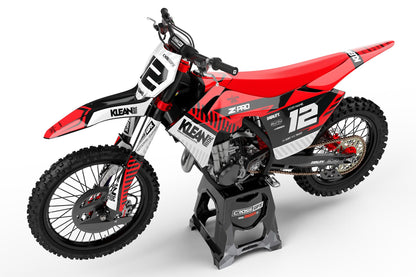Left side view of the Clean Red racing graphics kit on a GasGas dirt bike.