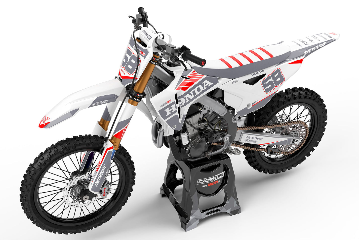 Perspective view of the Blitz White custom graphics kit on a Honda off-road motorcycle.