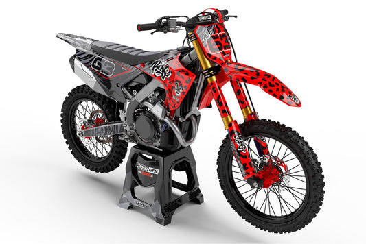 Front view of the Red Panther motocross graphics kit on a Honda dirt bike.