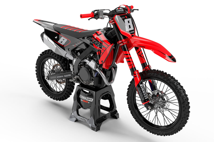 Front view of the Crisp Red graphics kit on a Honda motocross bike.