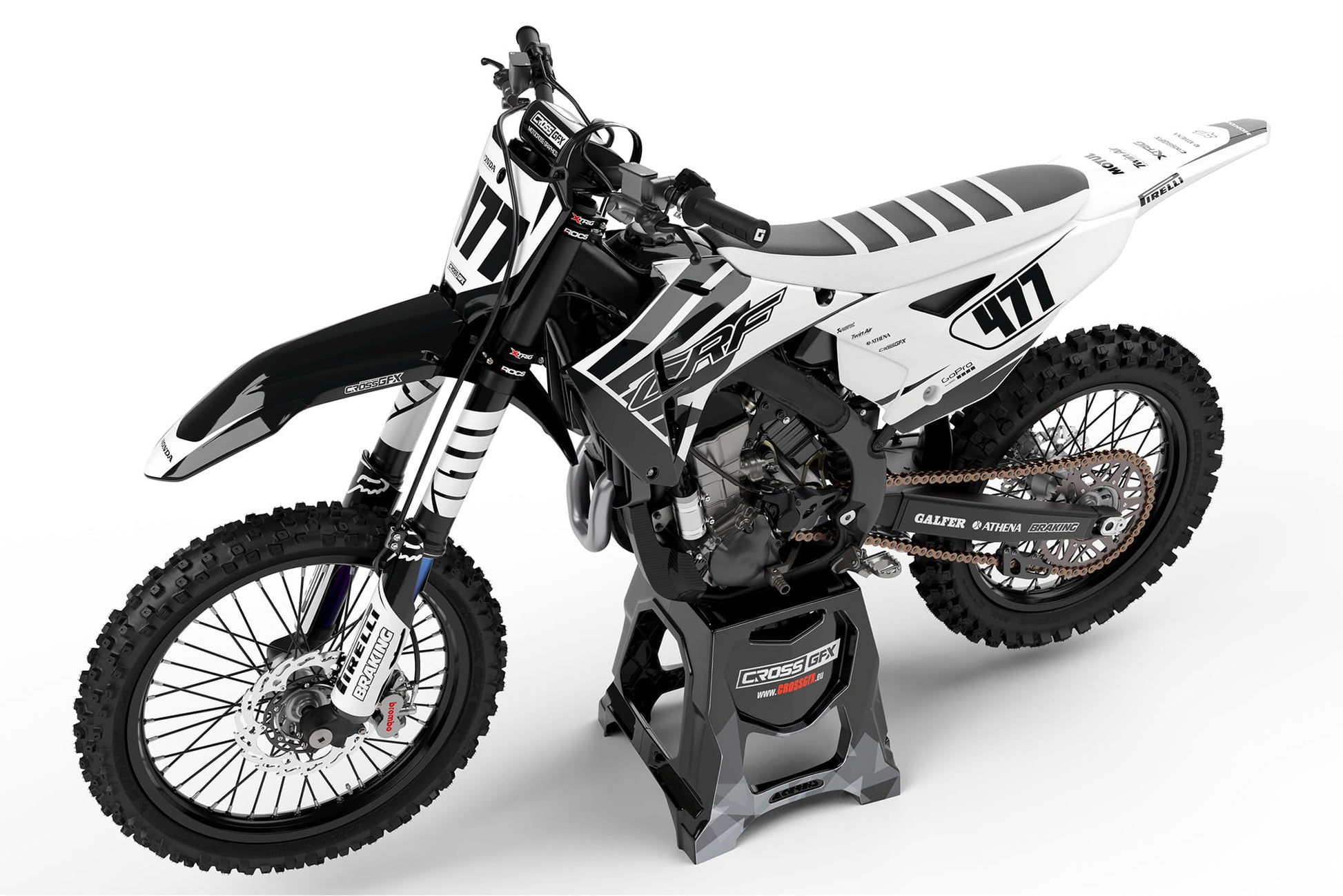 Perspective view of the Crisp White off-road graphics kit on a Honda dirt bike.