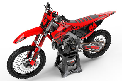 Left side view of the Force Red custom graphics kit on a Honda dirt bike.