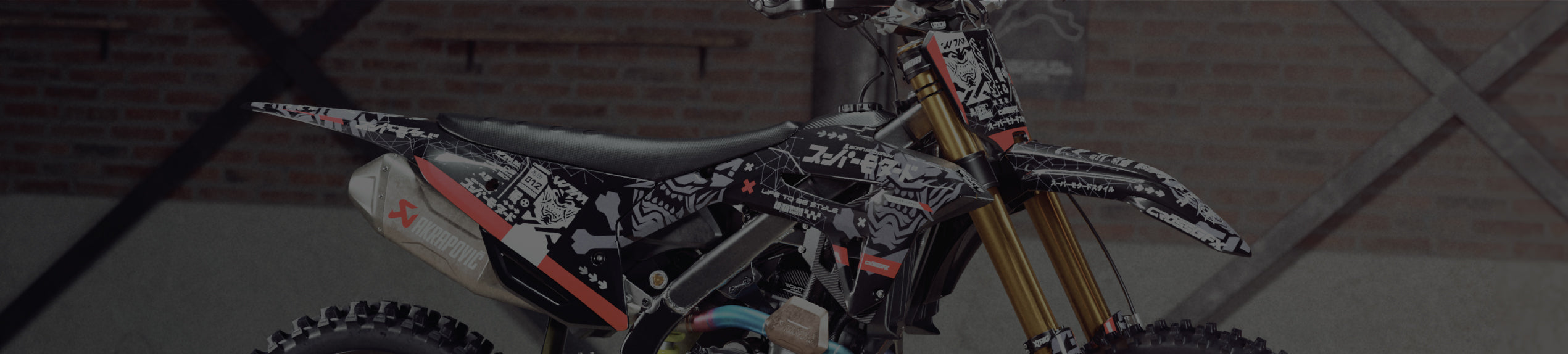 Honda CRF dirt bike with CrossGFX black and white skull decal kit