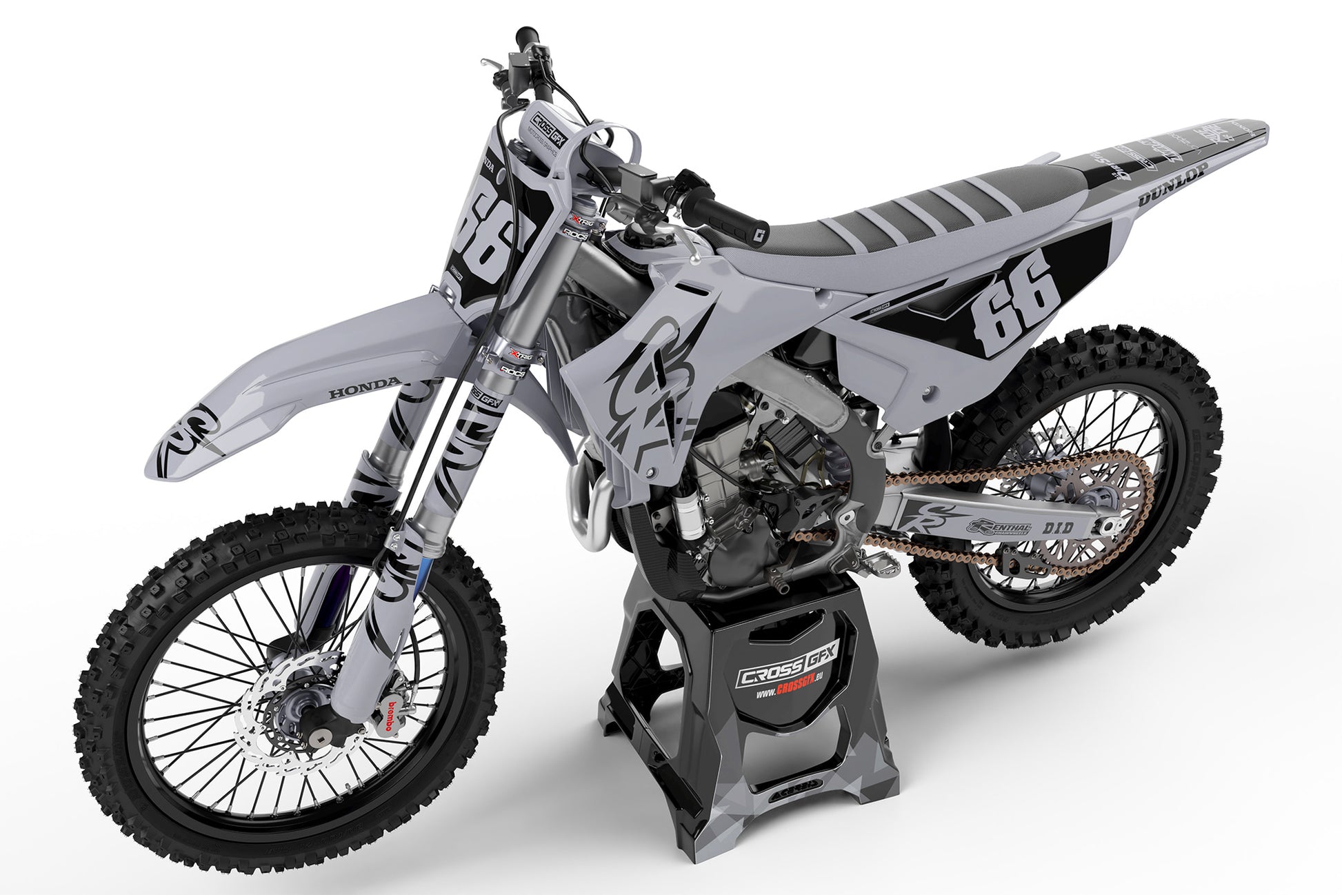 Side view of the Retro 94 Grey motocross graphics kit on a Honda racing bike.