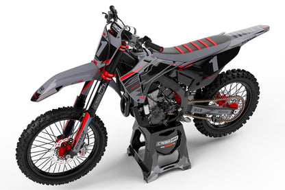 Left side view of the Surge Grey graphics kit on a Honda dirt bike.