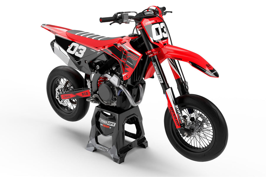 Front view of the Surge Red graphics kit on a Honda motocross bike.
