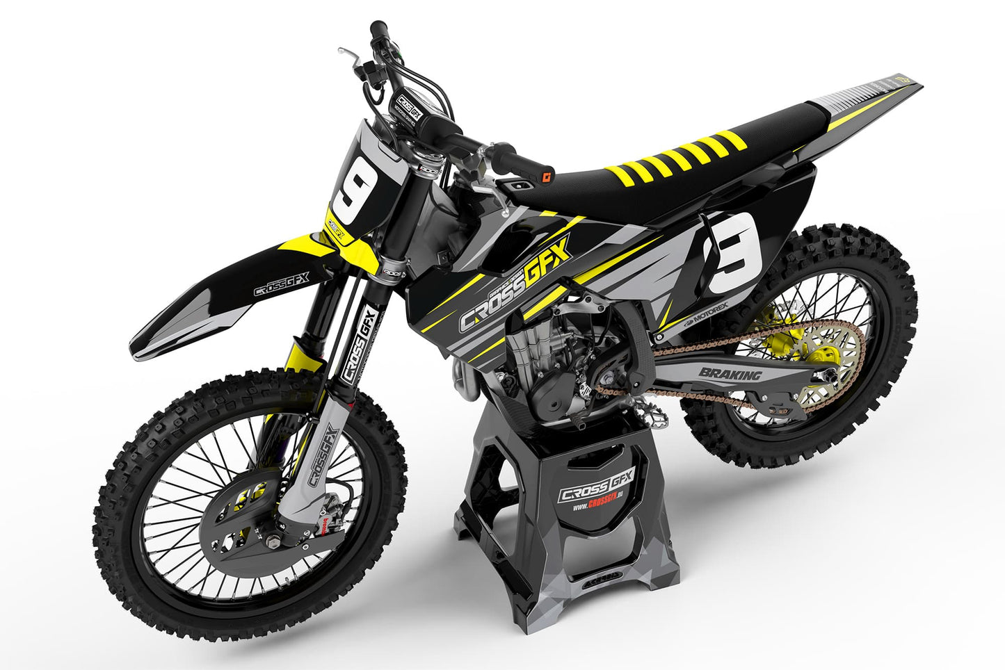 Side view of the Apex Black custom graphics kit on a Husqvarna dirt bike.