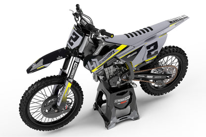 Left side view of the Xcel Black custom graphics kit on a Husqvarna motorcycle.