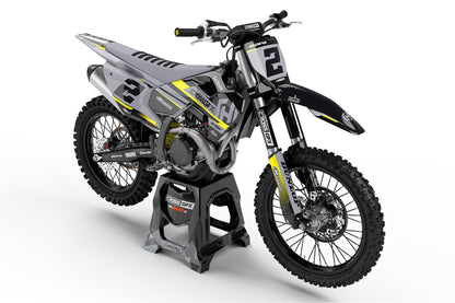 Front view of the Xcel Black graphics kit on a Husqvarna motocross bike.