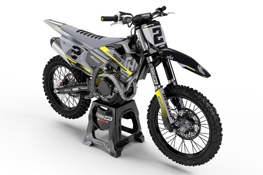 Front view of the Xcel Black graphics kit on a Husqvarna motocross bike.